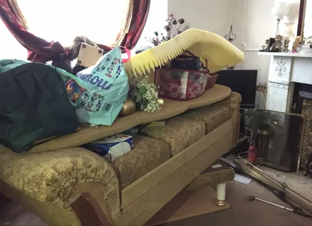 Belongings piled high in a home in Carlisle