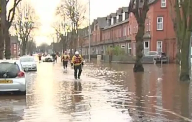 Warwick Road in Carlisle with rescuers