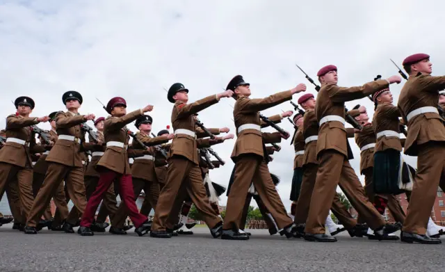 Junior soldiers march around the Regimental square during their graduation parade