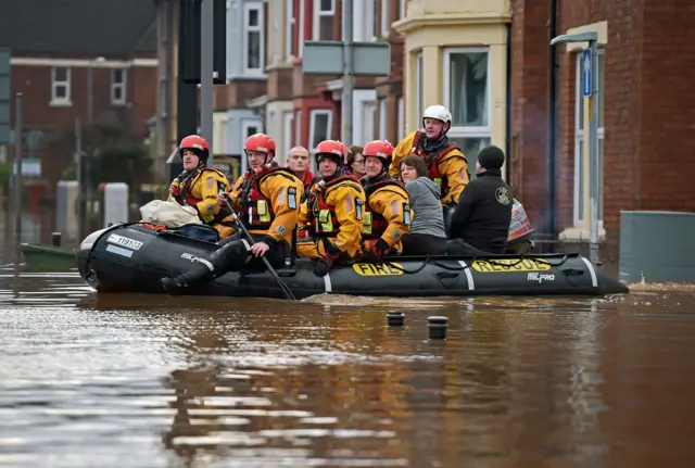 People being rescued on a lifeboat in Carlisle