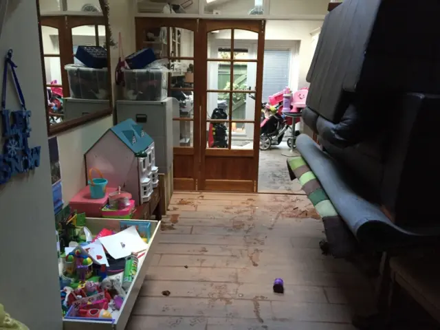 Belongings piled high in a home in Carlisle