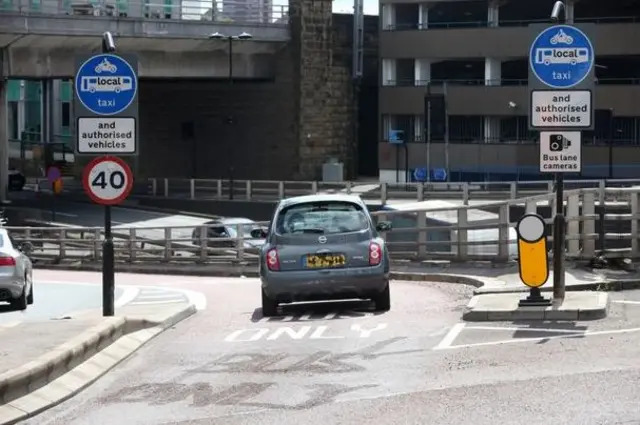 Car in bus lane