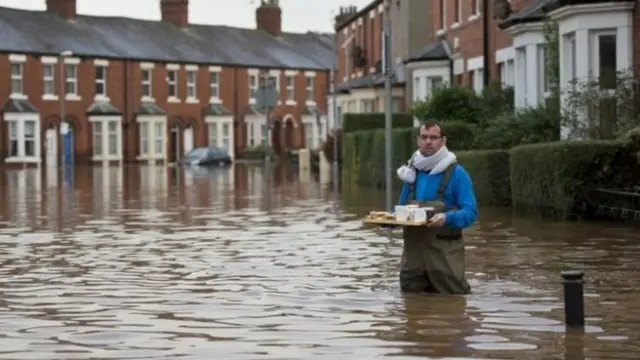 Man with tea and biscuits