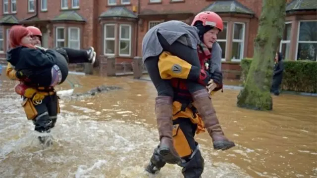 People being carried to safety