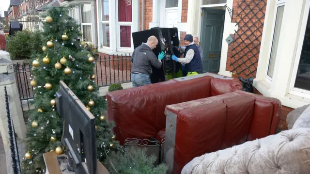 Heavy items being moved out of a house