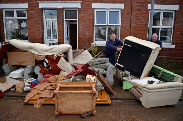 Debris outside homes in Carlisle