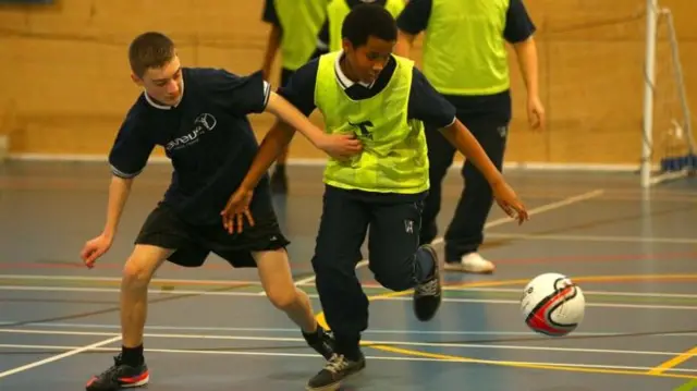 Pupils play football