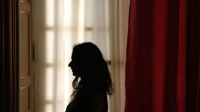 A woman in silhouette