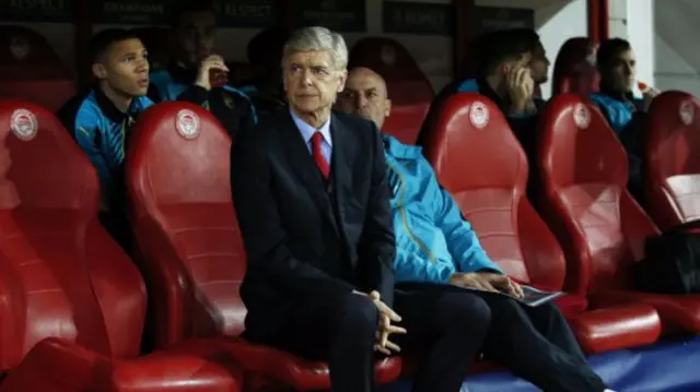 Arsene Wenger watches on