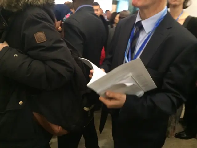 delegate clutching a draft