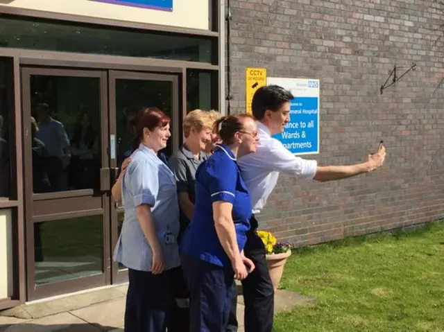 Labour leader Ed Miliband poses for a photograph with nurses at a hospital in Keighley, near Bradford - 11 April 2015