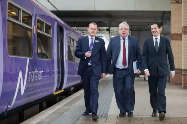 left to right) Managing Director of Northern Rail Alex Hynes, Transport Secretary Patrick McLoughlin and the Chancellor of the Exchequer George Osborne