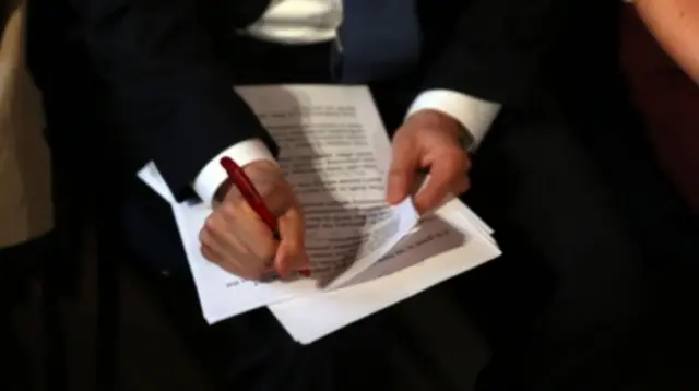 Ed Miliband making notes