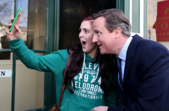 David Cameron taking a selfie with a voter