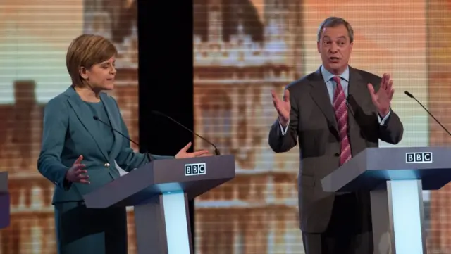 Nicola Sturgeon and Nigel Farage gesticulate