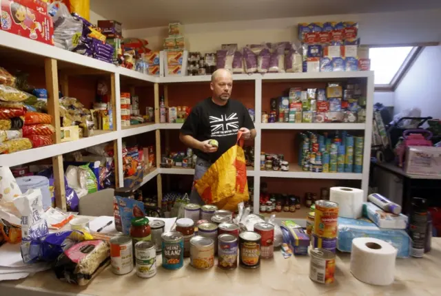 Volunteer William Forey at Drumchapel food bank near Glasgow