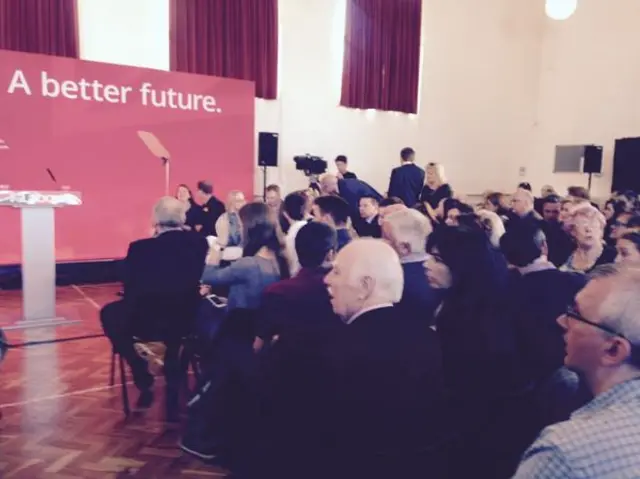 Labour supporters wait for Ed Miliband to speak at a campaign event in The Wirrall - 18 April 2015