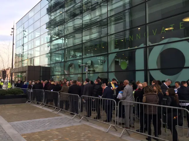 Audience members queue for TV debate