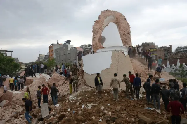 epalese rescue members and onlookers Nepalese rescue authorities gather at the collapsed Darahara Tower in Kathmandu on April 25, 2015