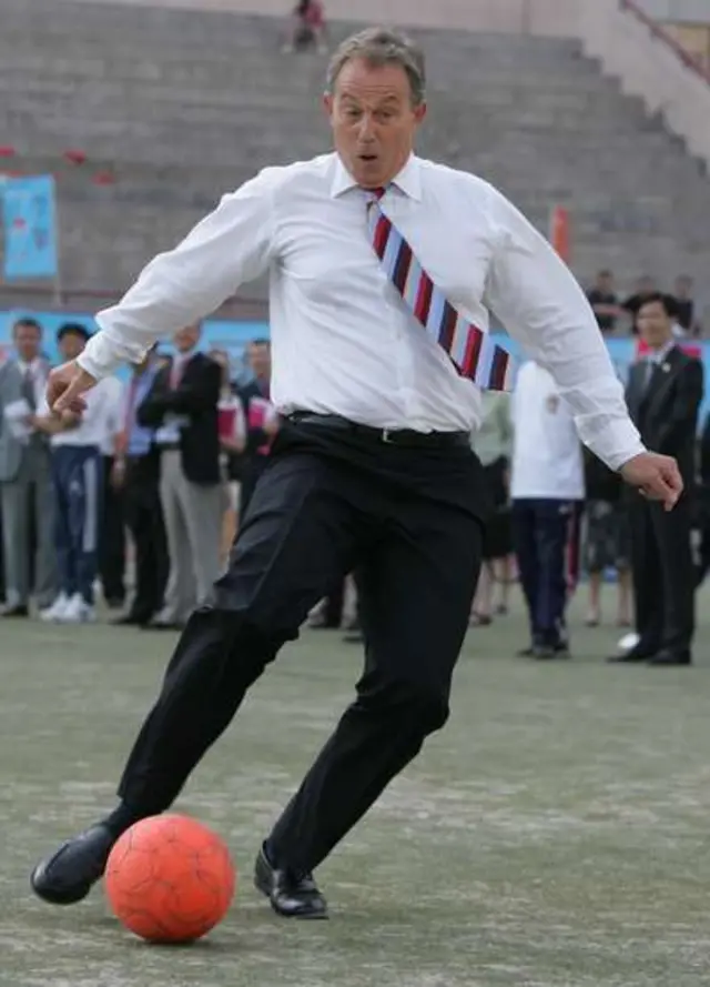 Tony Blair playing football