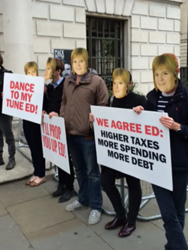 Conservative activists wearing Nicola Sturgeon masks