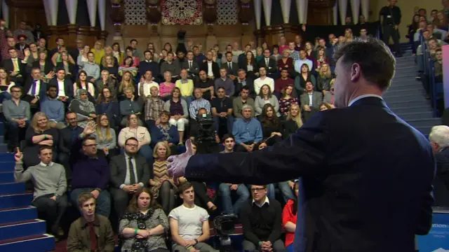 Nick Clegg, viewed from behind the stage