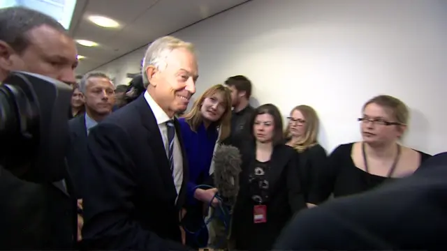 Tony Blair in a corridor