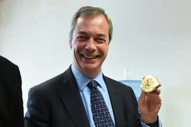 Nigel Farage with a UKIP cupcake