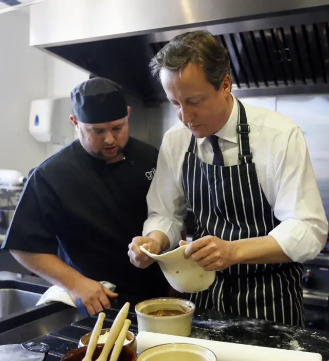 David Cameron making a pie