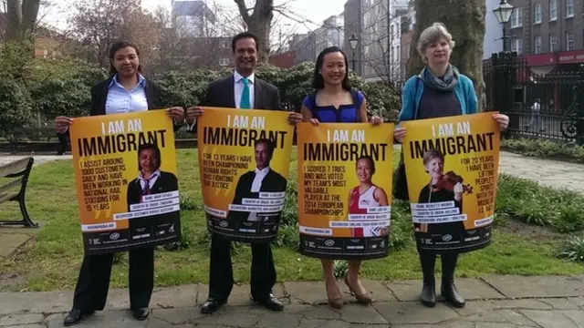 From left to right: Mary Sithole, S Chelvan, Lois Lau and Nicolette Moonen with "I am an immigrant" posters