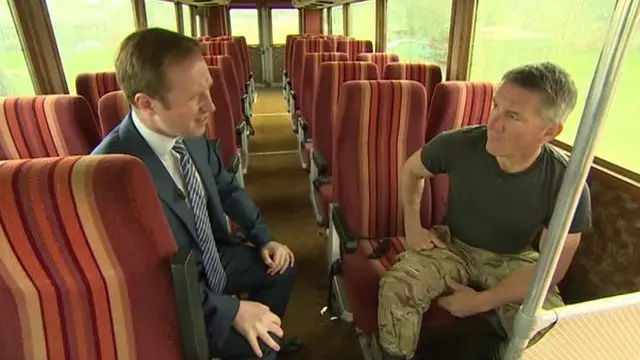 Adam Fleming with Todd Chamberlain of Tanks A Lot on a military vehicle used to transport Margaret Thatcher and government figures around Northern Ireland