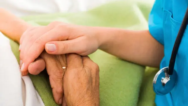 nurse and patient's hands