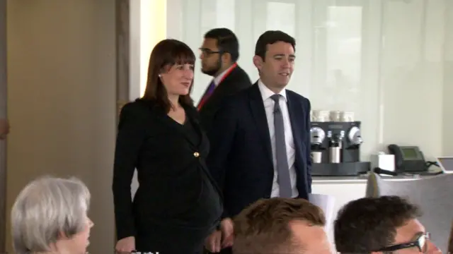 Andy Burnham arrives to give a speech in London, accompanied by shadow work and pensions secretary Rachel Reeves