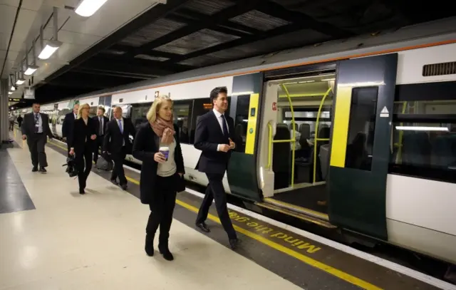 Ed Miliband and aides at London Victoria