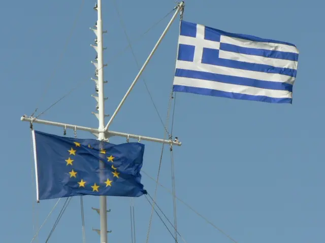 Greek and EU flags