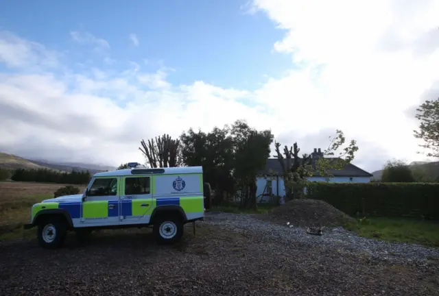 A police Land Rover outside Caberfeidh cottage