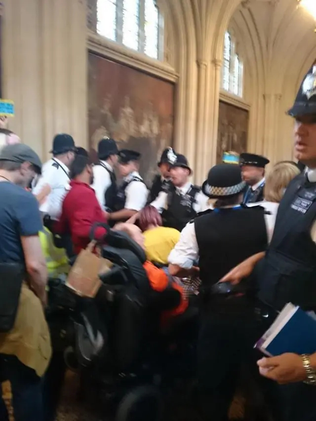 Protestors and police in Parliament