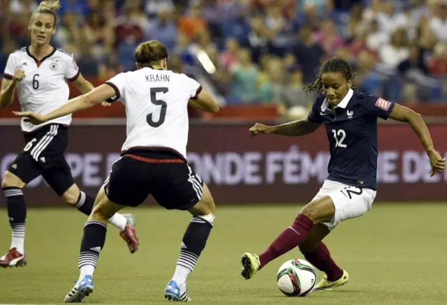 Elodie Thomis runs with possession of the bal