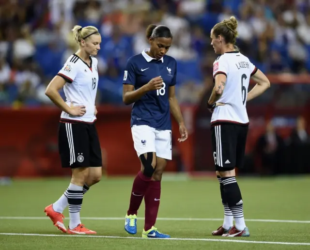 Alexandra Popp and Simone Laudehr of Germany look on