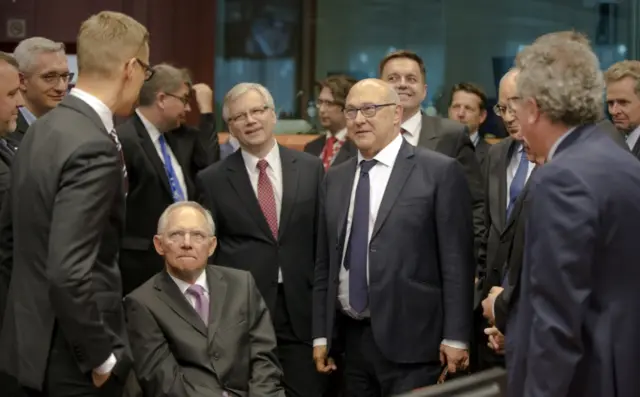 Michel Sapin (C) with Eurogroup colleages