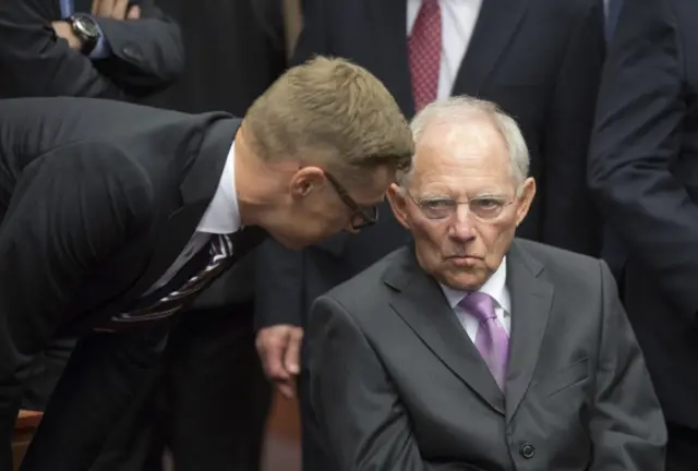 German Finance Minister Wolfgang Schaeuble (R)