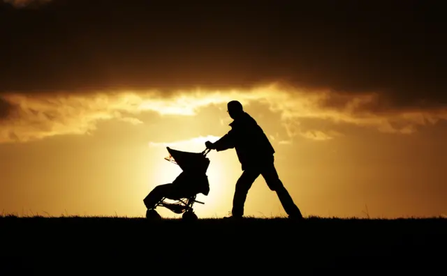 Man pushing buggy