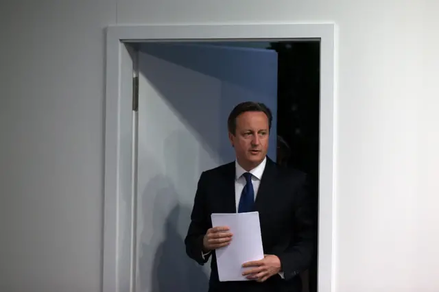 David Cameron entering a press conference in the Bavarian town of Schloss Elmau