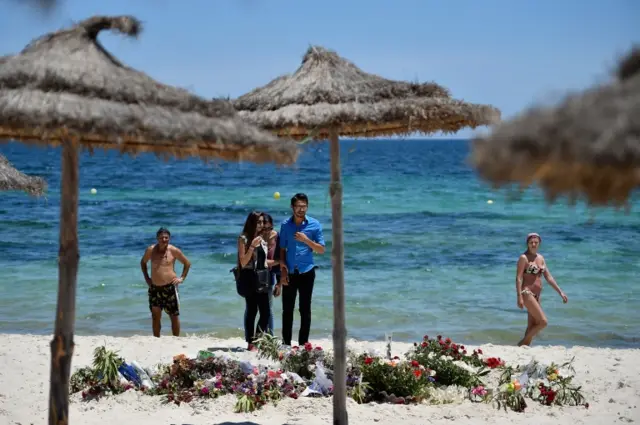 Floral tributes laid at the scene of the killings of tourists in a beach in Sousse