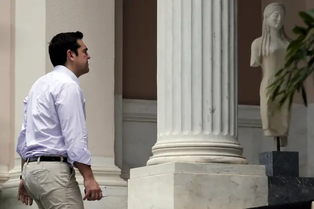 Greek PM Alexis Tsipras arrives for work