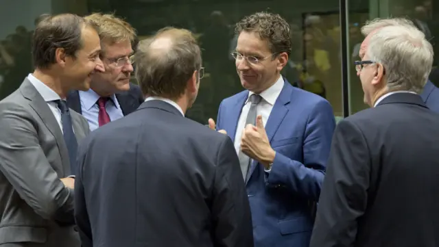 Dutch Finance Minister Jeroen Dijsselbloem, center, gestures as he speaks with Belgium"s Finance Minister Johan Van Overtveldt, second left, and other colleagues during a meeting of eurozone finance ministers at the EU Lex building in Brussels on 11 July