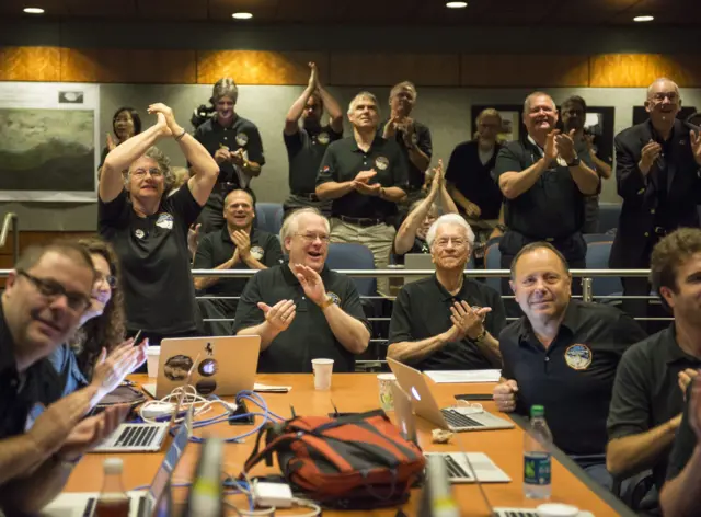 New Horizons team members celebrating