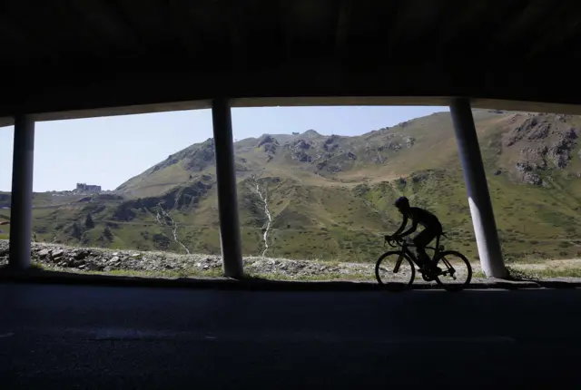 A rider climbs in the Tour de France