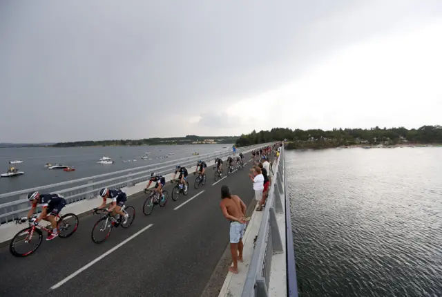 The pack make their way over a bridge