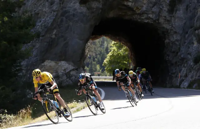 Chris Froome rides with his team mates